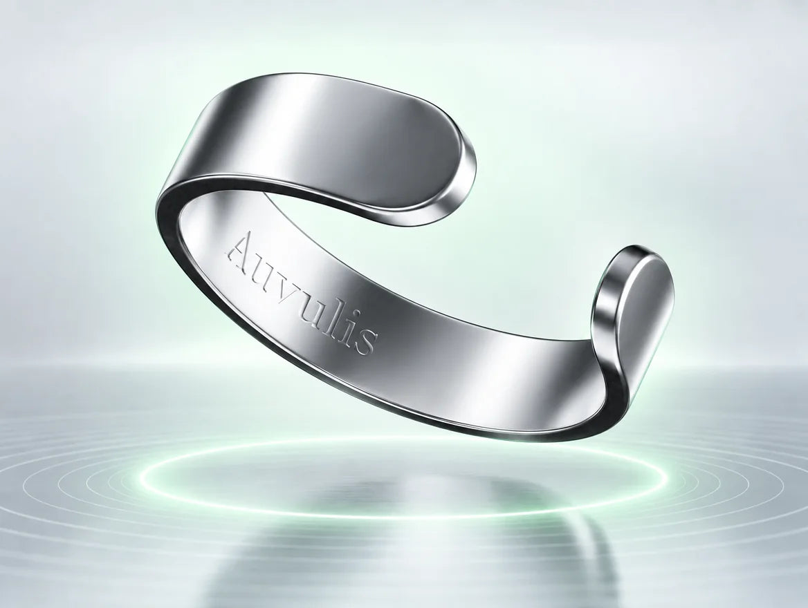 The Vitality Ring, a polished open-cuff ring, floating over a soft mint halo of light