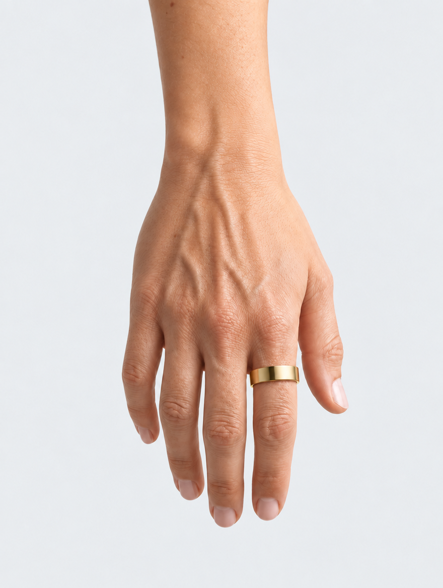 Hand wearing the gold Vitality Ring